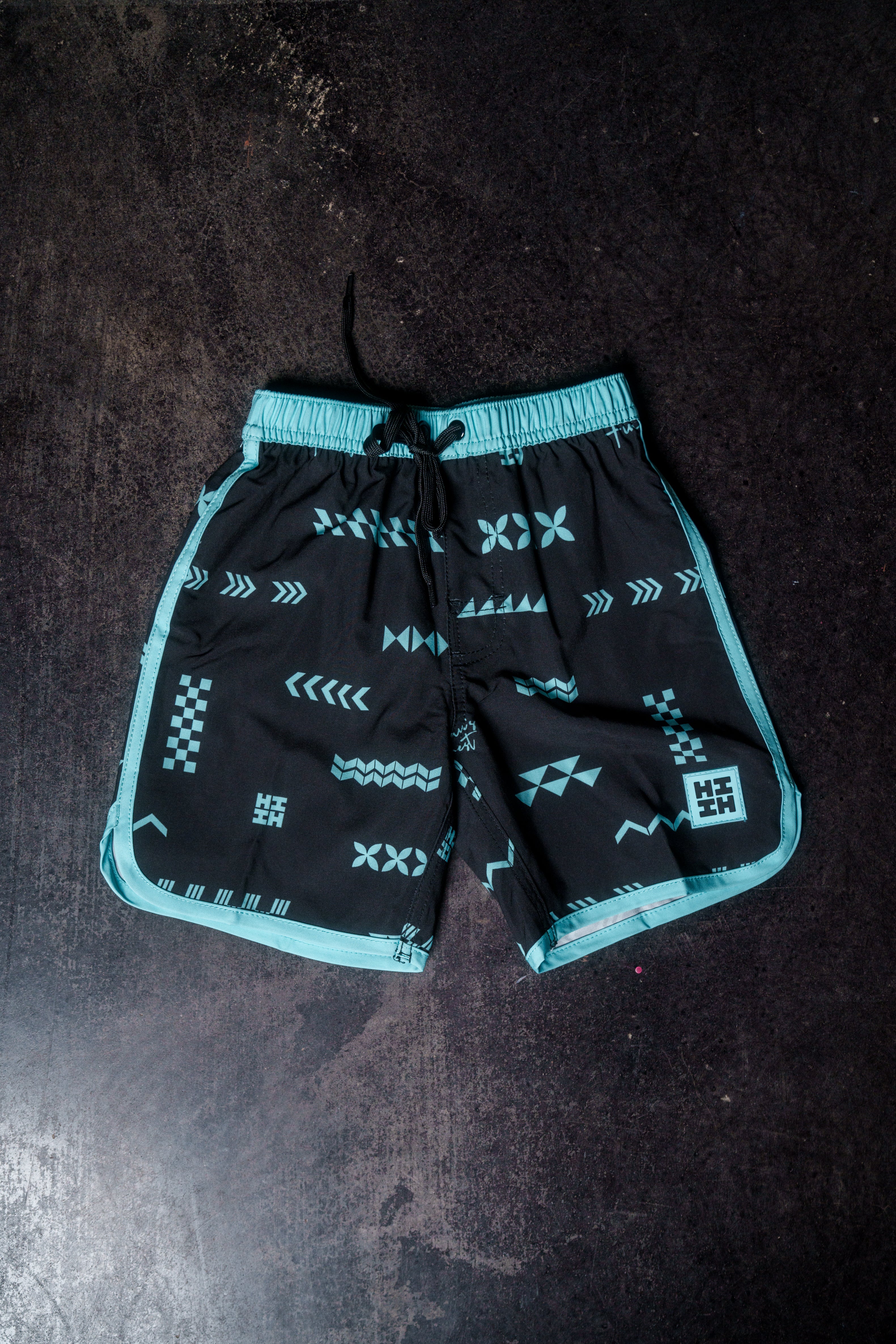 ʻANO KĀPALA KEIKI BLACK & MINT BOARDSHORTS