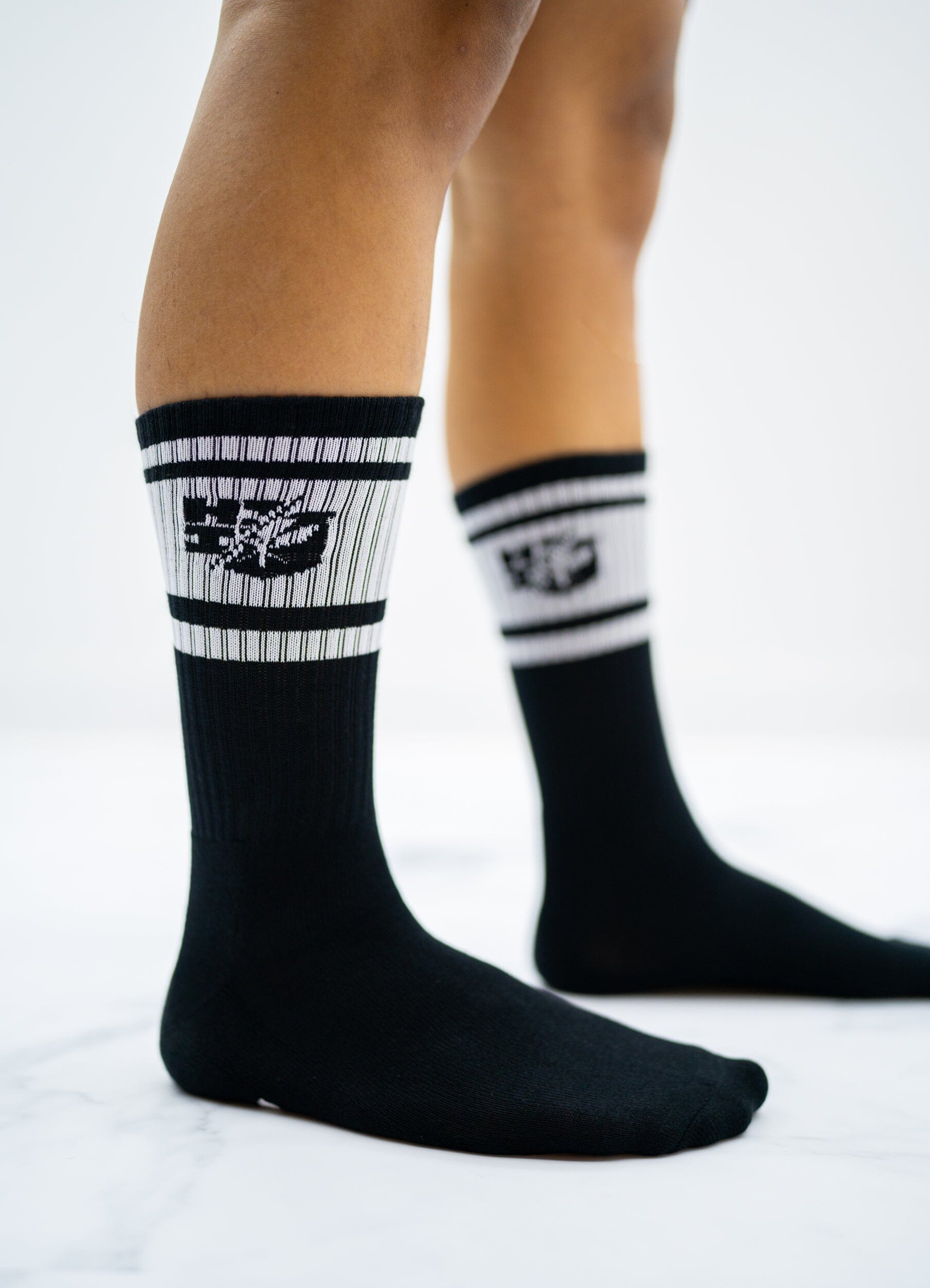 https://shop.hifinest.com/cdn/shop/products/black-white-split-logo-socks-socks-hawaiis-finest-880683_1806x.jpg?v=1684221431